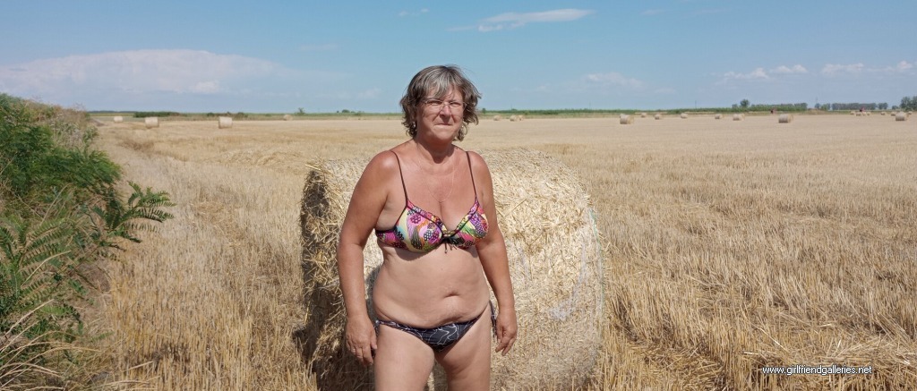 next to straw bales