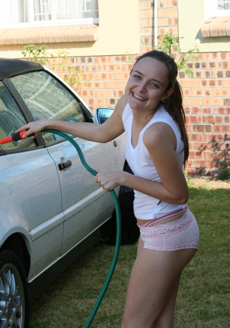 Slutty Davida getting wet and naked washing her car